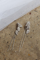Boucles d'oreilles pendantes en forme de feuilles en zircon argenté