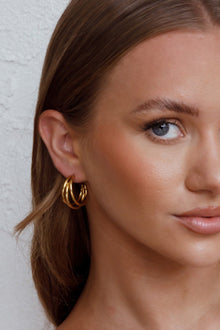 Boucles d'oreilles ouvertes triple Dominique en or