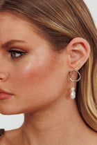 Boucles d'oreilles pendantes Amelie en perles dorées