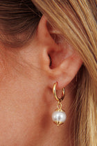 Boucles d'oreilles goutte en perles d'ébène dorées
